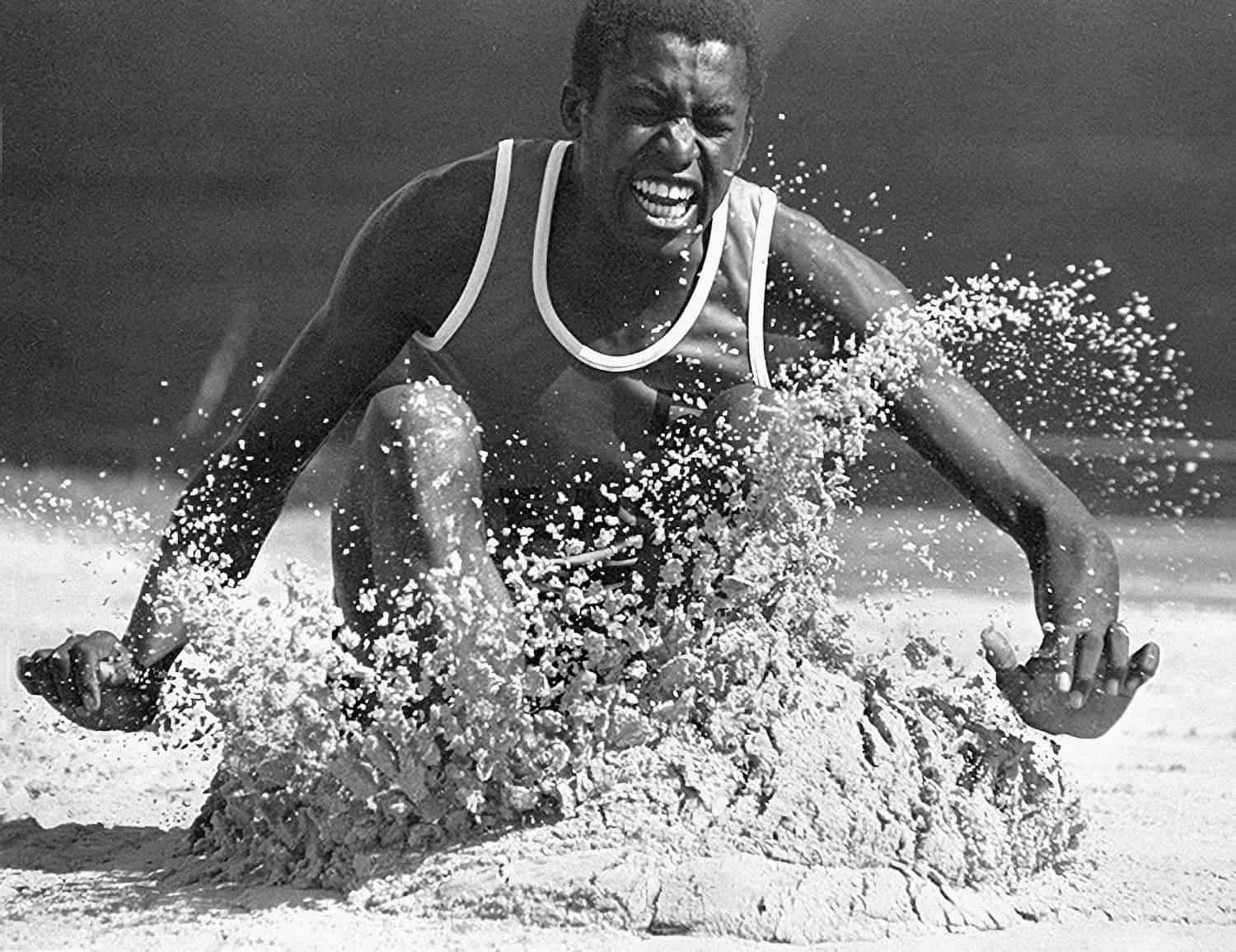 Commonwealth Games long jump athlete - sports photograph by Chris Smith