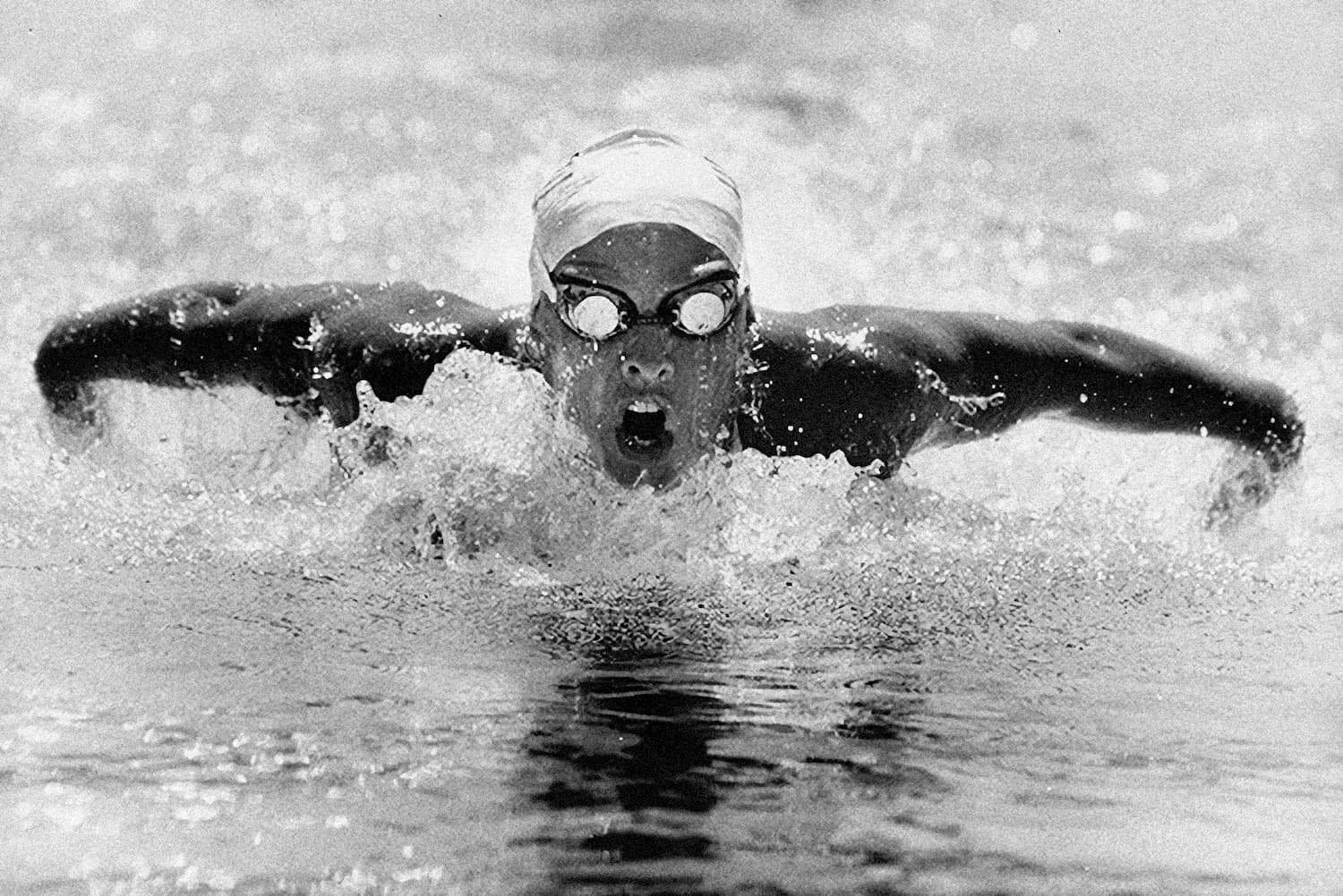Butterfly swimmer close-up - sports photograph by Chris Smith