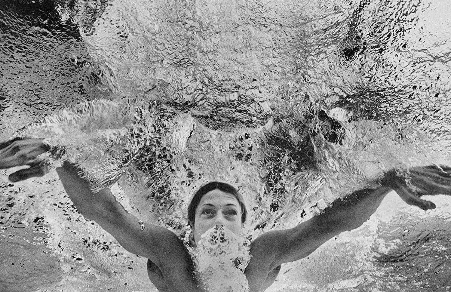 Butterfly swimmer in action - sports photograph by Chris Smith